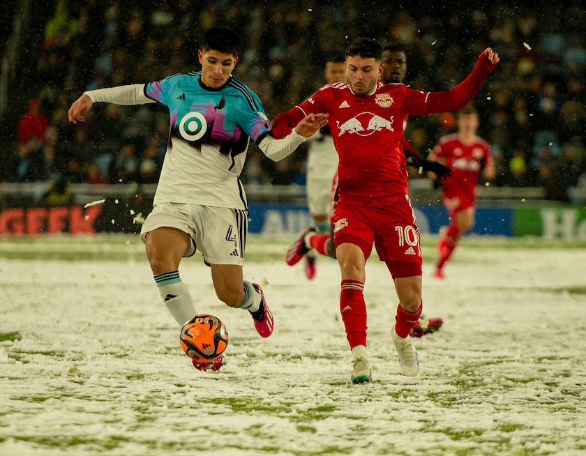 Miguel Tapias competes for a ball in the snow at MNUFC's home opener.