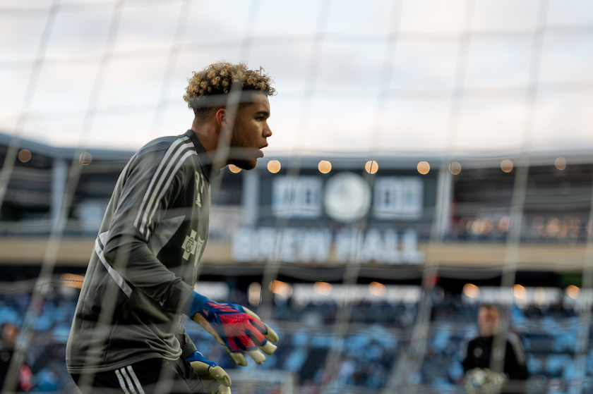 MNUFC goalkeeper Dayne St. Clair, with a clock in the background